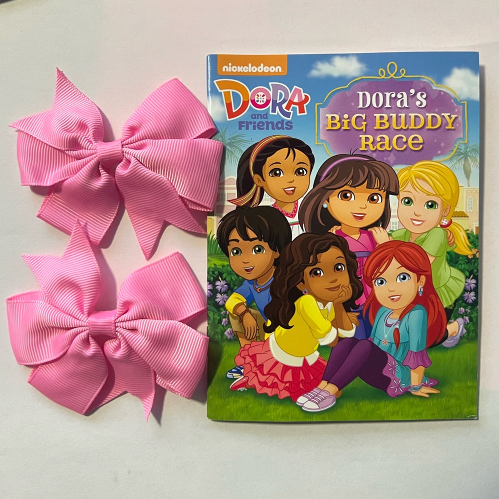 Set! Nickelodeon Dora's Big Buddy Race Book with Bows set: English and Spanish.